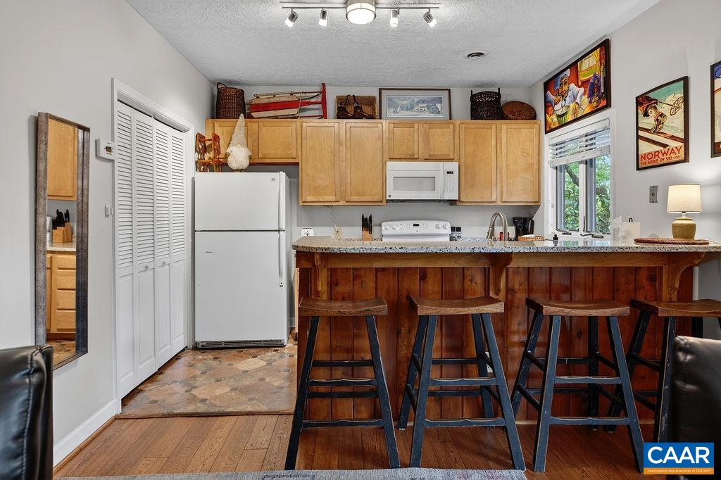 410 Three Ridges Roseland, VA 22967 - Photo 15 of 21 a kitchen with a refrigerator and a table