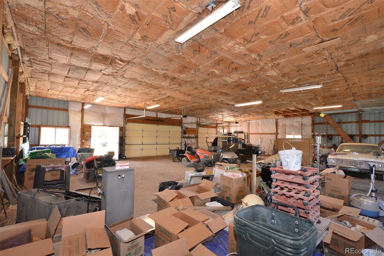 30640 Aldred Road Pueblo, CO 81006 - Photo 12 of 34 a lots of gym equipment sitting on a floor