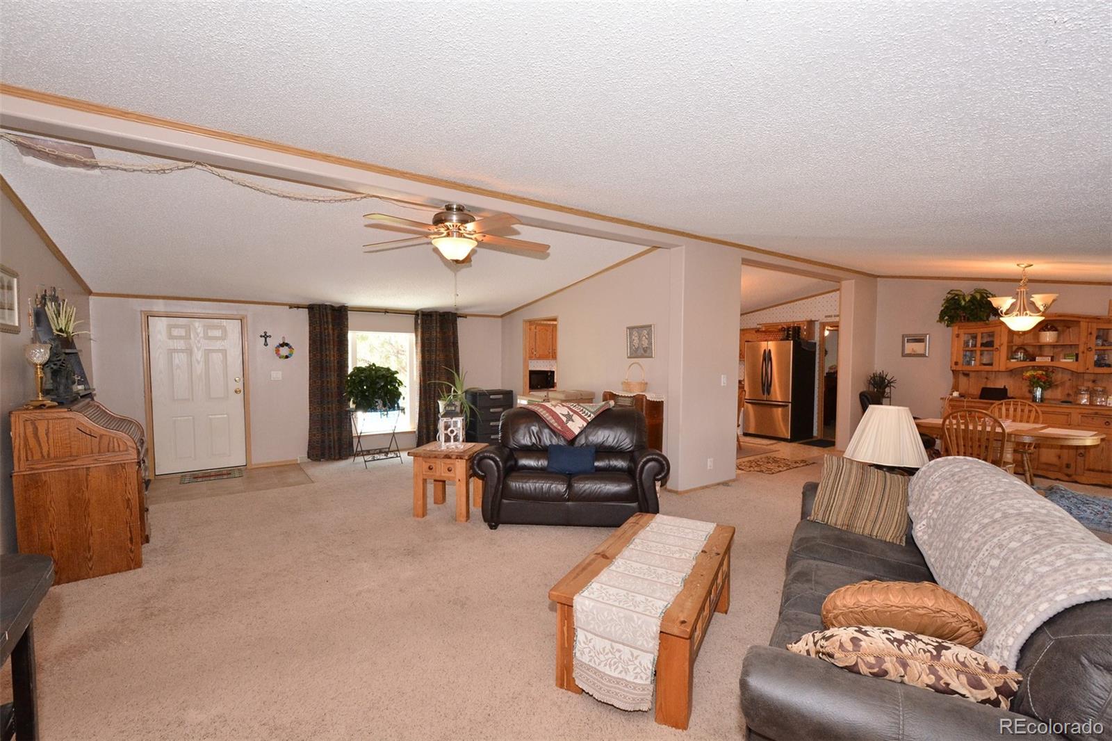 30640 Aldred Road Pueblo, CO 81006 - Photo 18 of 34 a living room with furniture and a large window