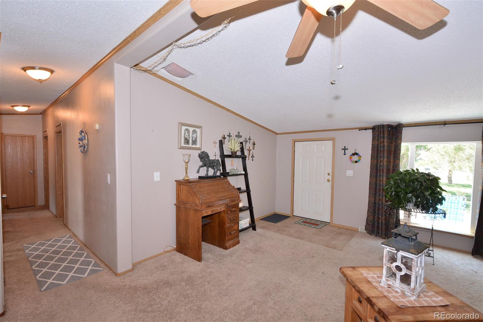 30640 Aldred Road Pueblo, CO 81006 - Photo 28 of 34 a view of a livingroom with furniture and window