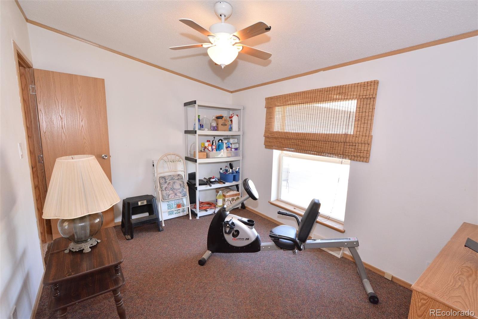 30640 Aldred Road Pueblo, CO 81006 - Photo 32 of 34 a view of a room with workspace and a window