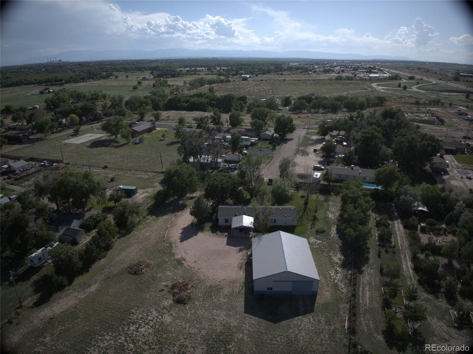 30640 Aldred Road Pueblo, CO 81006 - Photo 34 of 34 an aerial view of a house with a yard