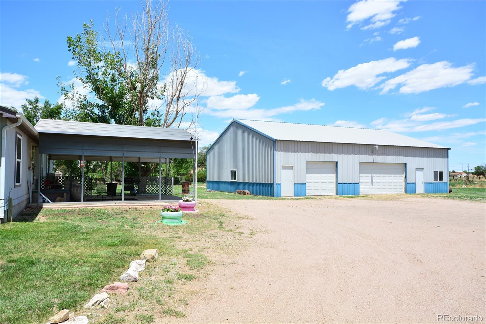 30640 Aldred Road Pueblo, CO 81006 - Photo 9 of 34 a house view with a garden space