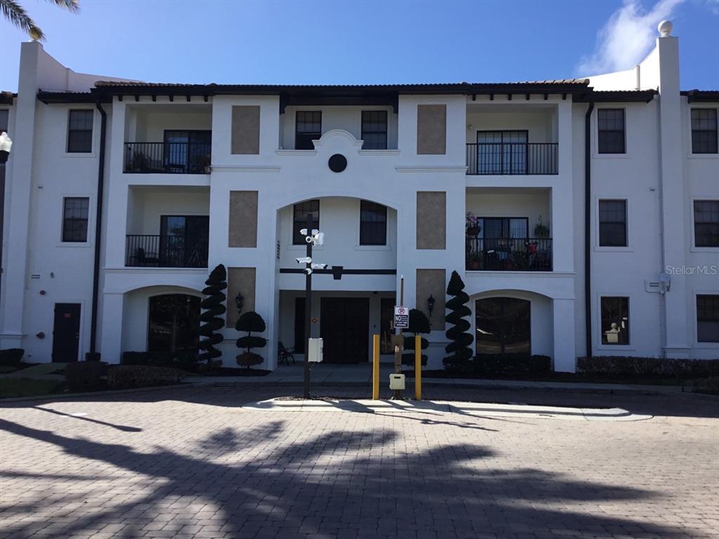 5550 East Michigan Street, Unit 3232 Orlando, FL 32822 - Photo 1 of 21 a front view of a house with yard