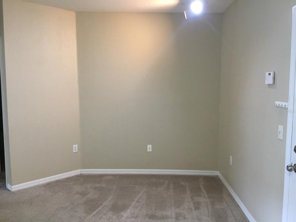 5550 East Michigan Street, Unit 3232 Orlando, FL 32822 - Photo 11 of 21 a view of an empty room