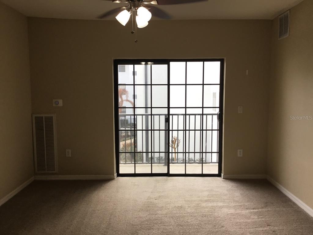 5550 East Michigan Street, Unit 3232 Orlando, FL 32822 - Photo 12 of 21 an empty room with windows