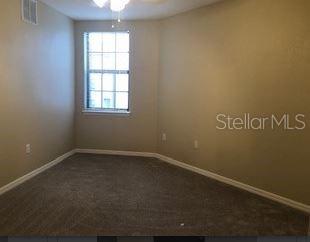 5550 East Michigan Street, Unit 3232 Orlando, FL 32822 - Photo 13 of 21 an empty room with a window