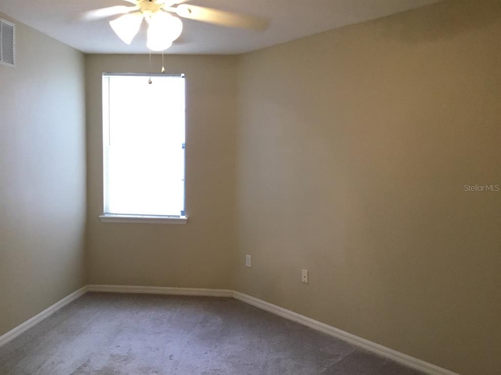5550 East Michigan Street, Unit 3232 Orlando, FL 32822 - Photo 16 of 21 an empty room with a window