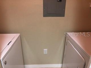 5550 East Michigan Street, Unit 3232 Orlando, FL 32822 - Photo 19 of 21 a utility room with dryer and washer