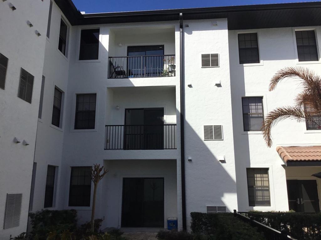 5550 East Michigan Street, Unit 3232 Orlando, FL 32822 - Photo 2 of 21 a front view of a house with roof