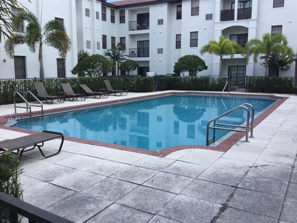 5550 East Michigan Street, Unit 3232 Orlando, FL 32822 - Photo 21 of 21 a view of a swimming pool with a patio