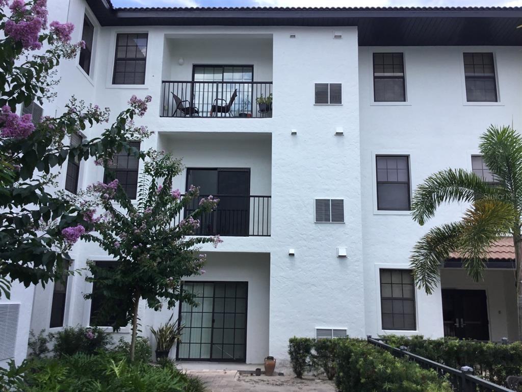 5550 East Michigan Street, Unit 3232 Orlando, FL 32822 - Photo 3 of 21 a house that has a tree in front of the house