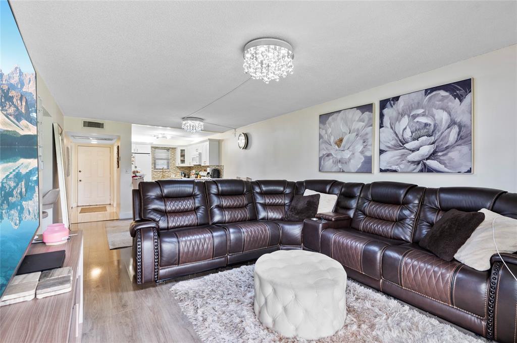 9300 Southwest 8th Street, Unit 102 Boca Raton, FL 33428 - Photo 9 of 23 a living room with furniture