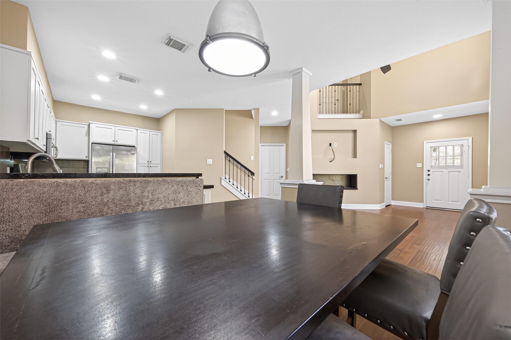 65 Scarlet Woods Court Spring, TX 77380 - Photo 13 of 36 a view of a kitchen with kitchen island a counter space a sink and appliances
