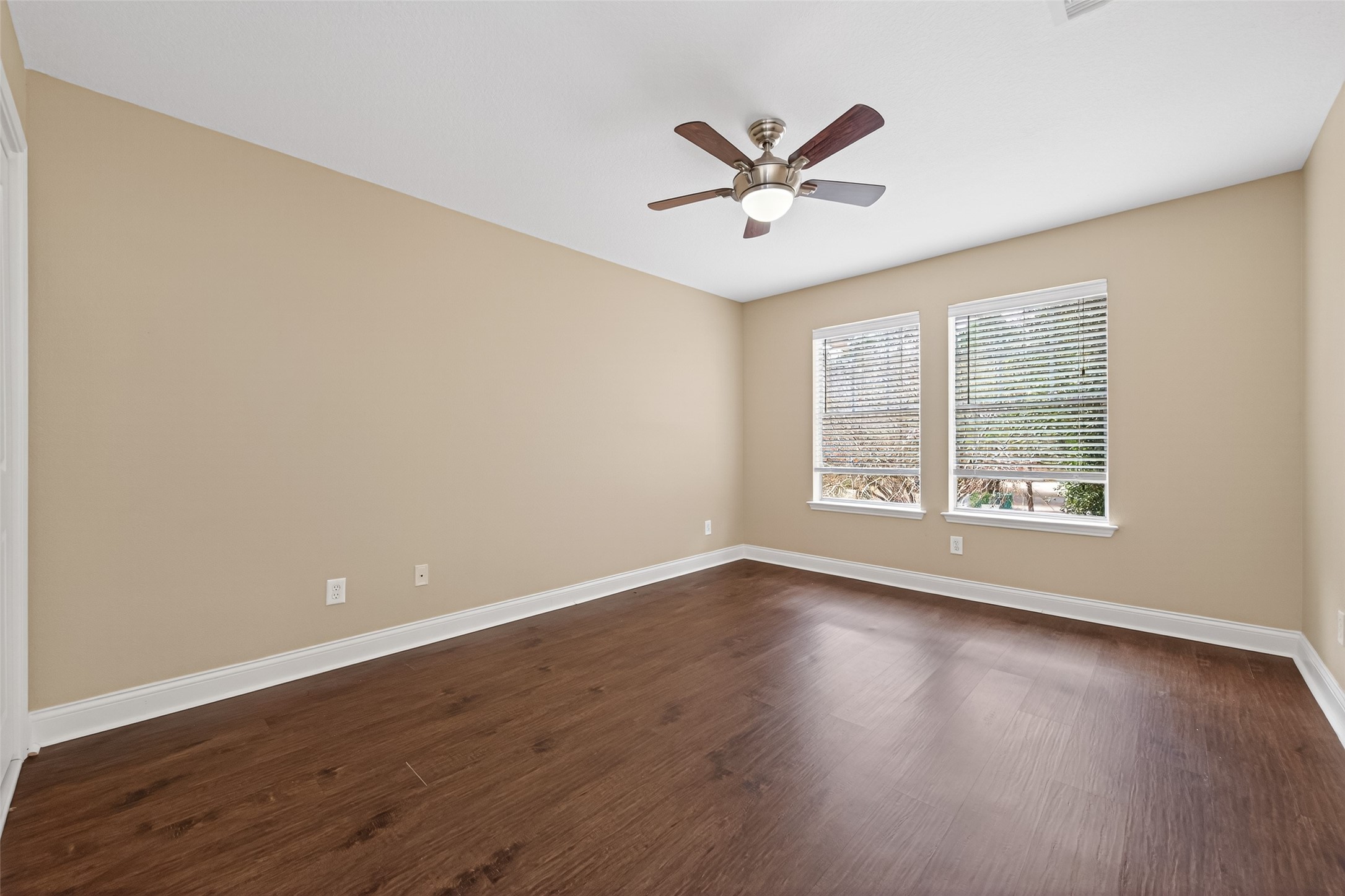 65 Scarlet Woods Court Spring, TX 77380 - Photo 17 of 36 a view of a big room with wooden floor and windows