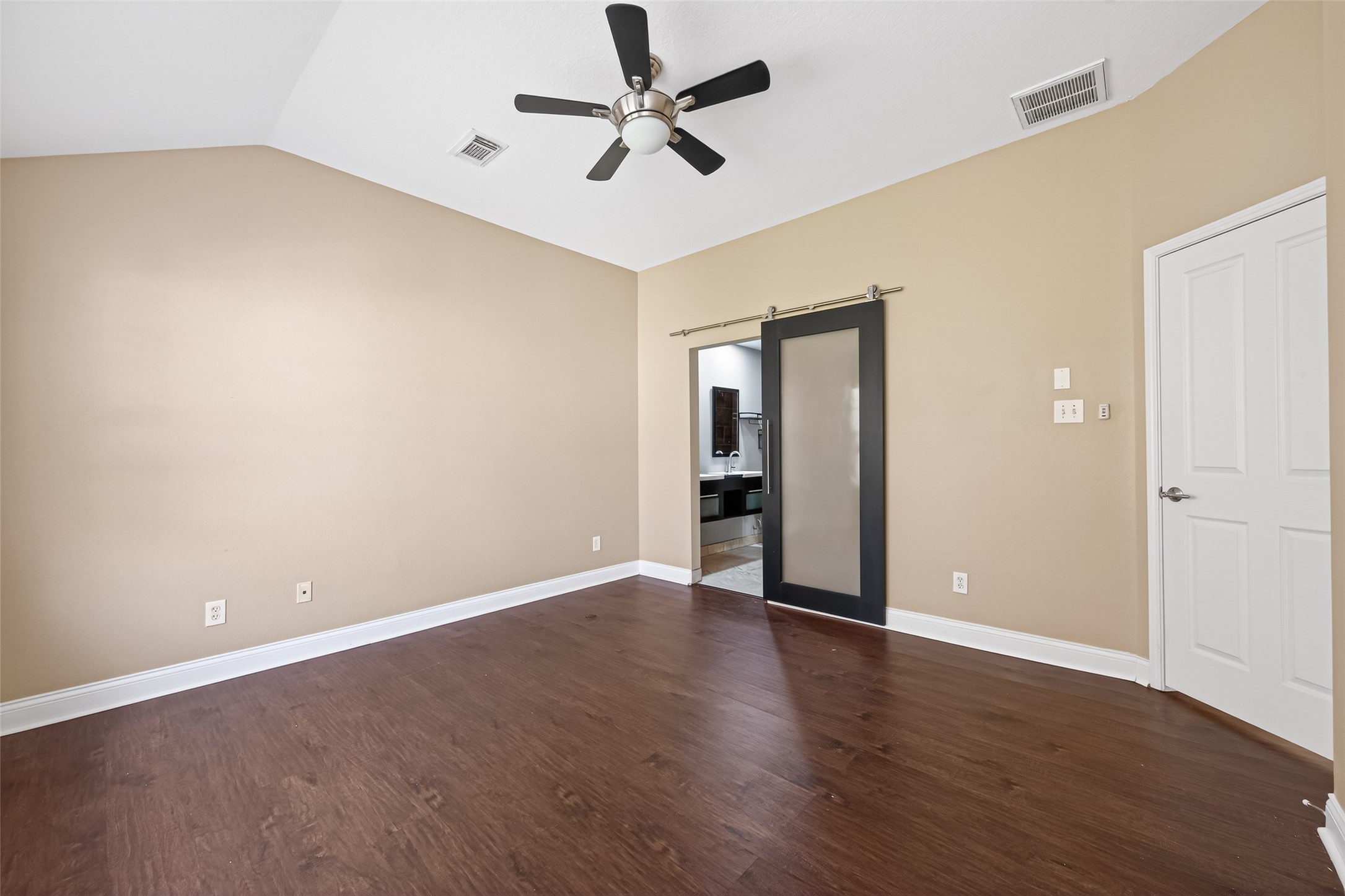 65 Scarlet Woods Court Spring, TX 77380 - Photo 22 of 36 an empty room with wooden floor and a ceiling fan