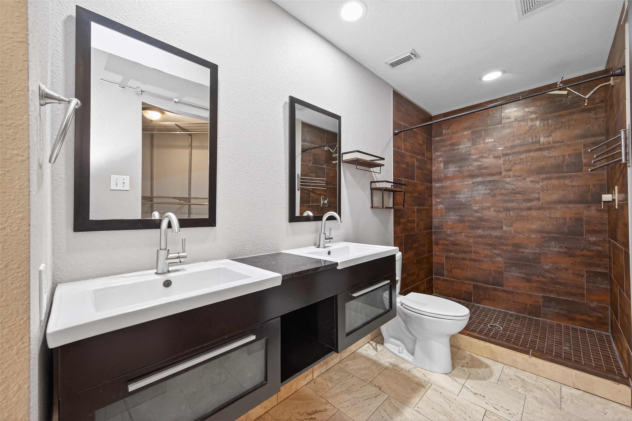 65 Scarlet Woods Court Spring, TX 77380 - Photo 24 of 36 a bathroom with a sink a toilet a mirror and shower