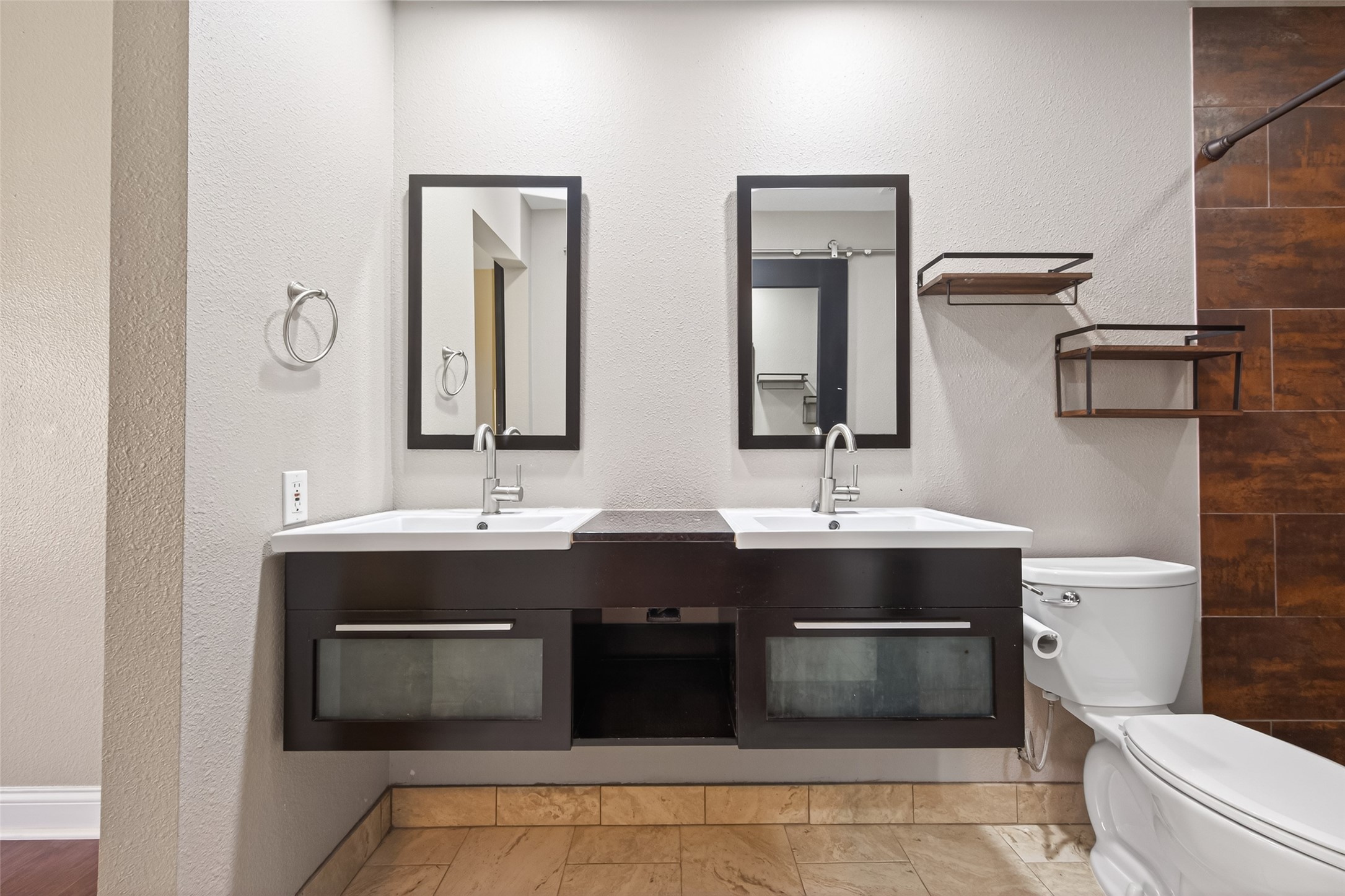 65 Scarlet Woods Court Spring, TX 77380 - Photo 25 of 36 a bathroom with a double vanity sink a toilet and a mirror