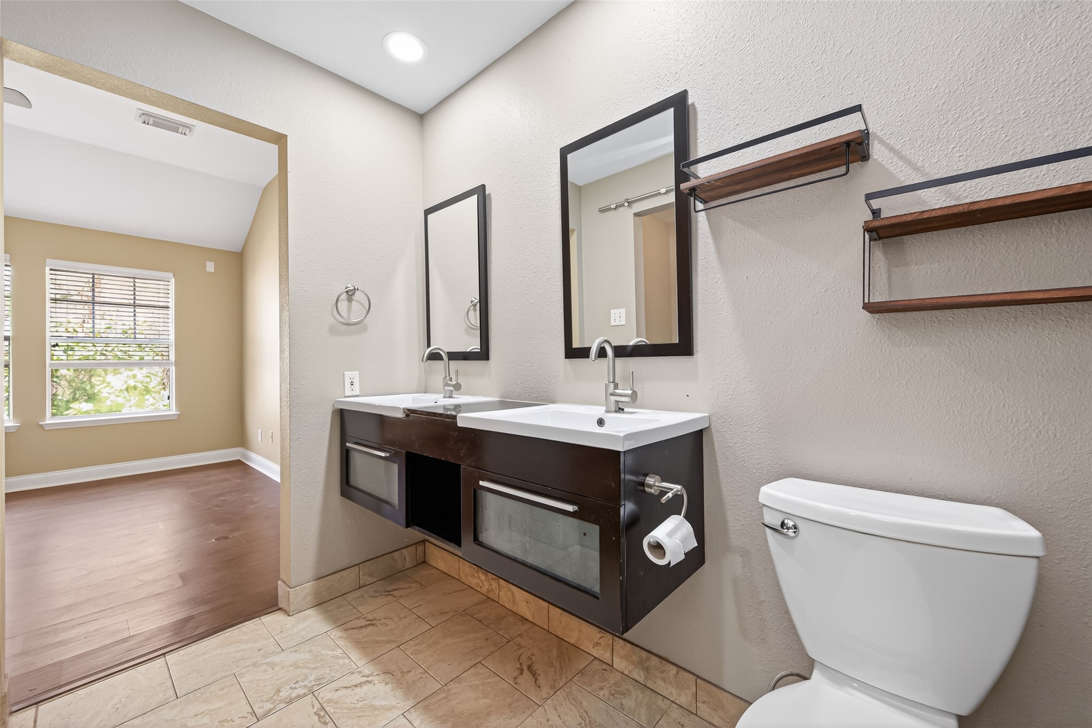 65 Scarlet Woods Court Spring, TX 77380 - Photo 26 of 36 a bathroom with a toilet sink and mirror