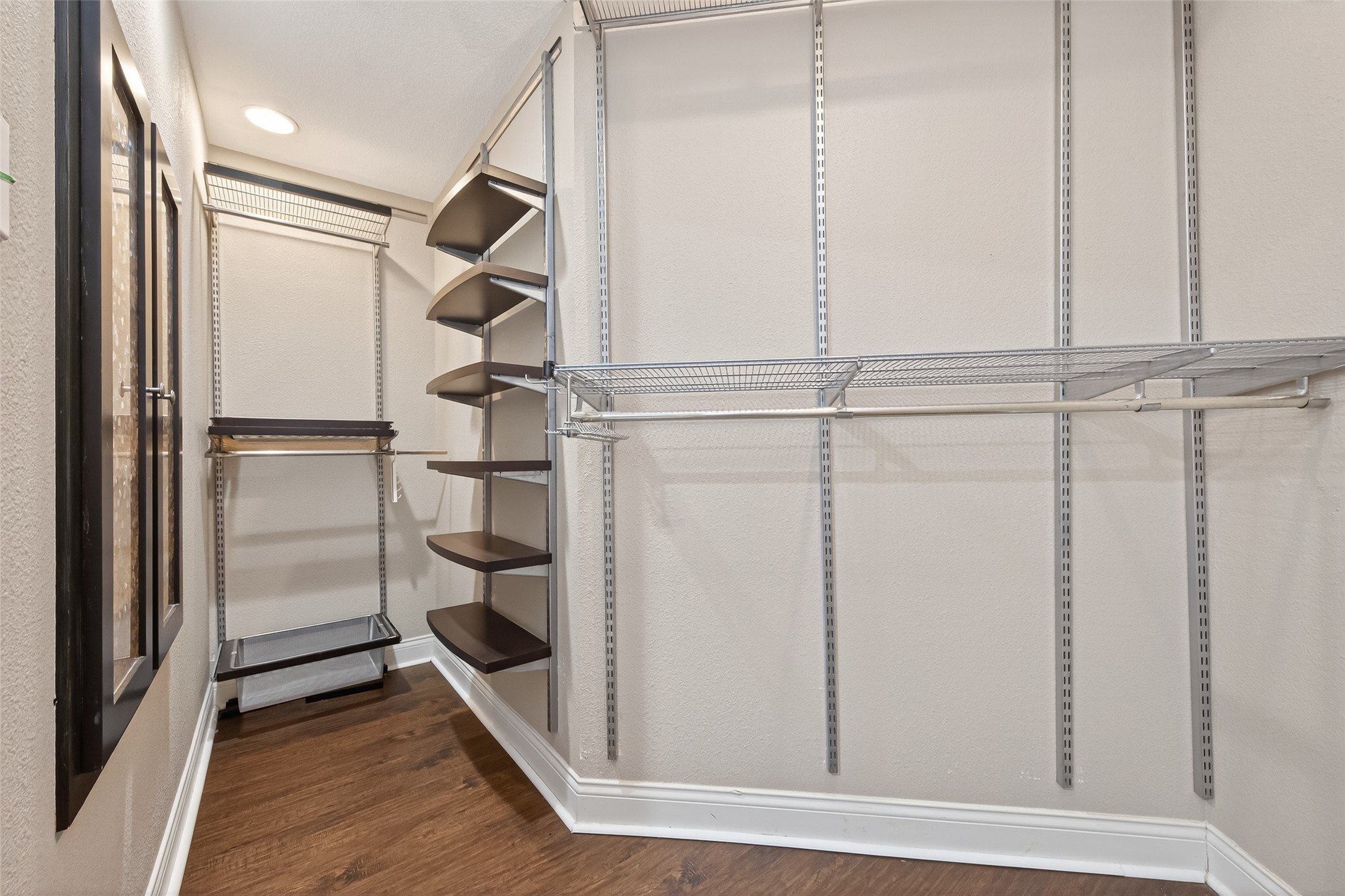 65 Scarlet Woods Court Spring, TX 77380 - Photo 27 of 36 a view of walk in closet with empty racks