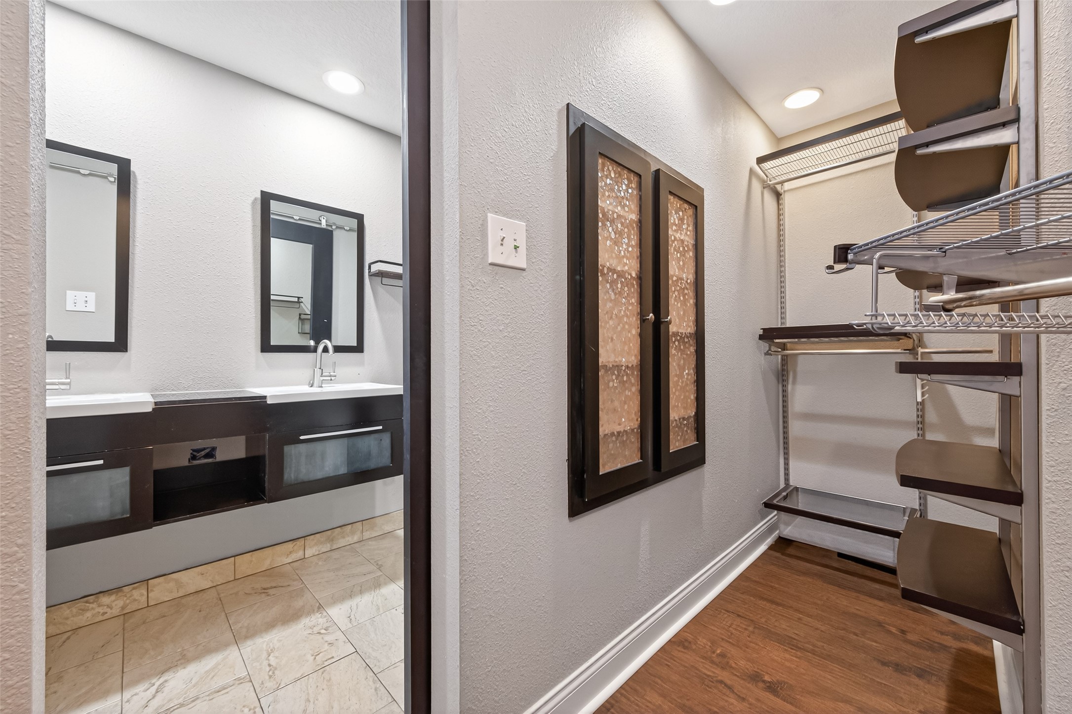 65 Scarlet Woods Court Spring, TX 77380 - Photo 28 of 36 a spacious bathroom with a double vanity sink and a mirror