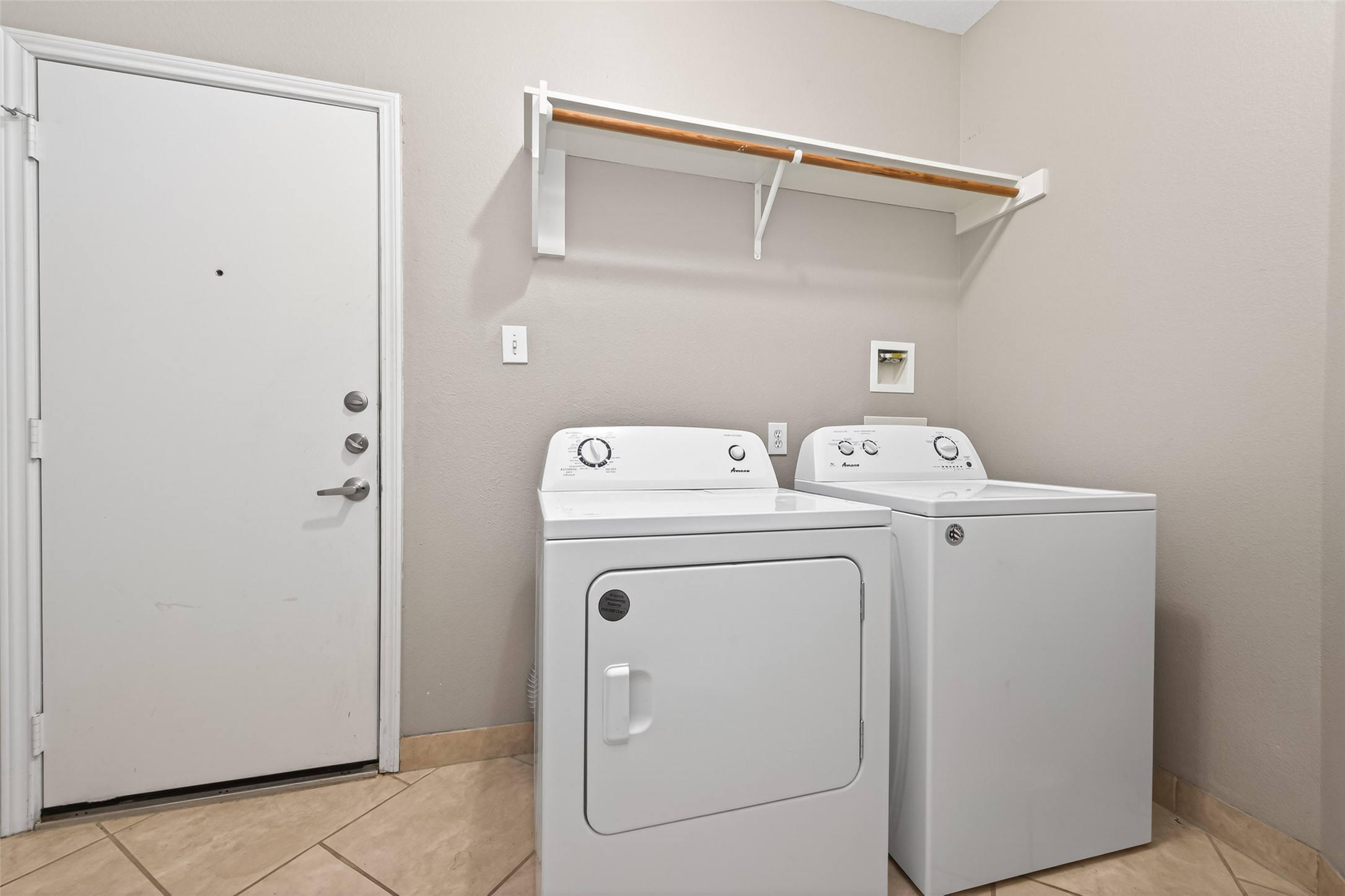 65 Scarlet Woods Court Spring, TX 77380 - Photo 29 of 36 a utility room with dryer and washer