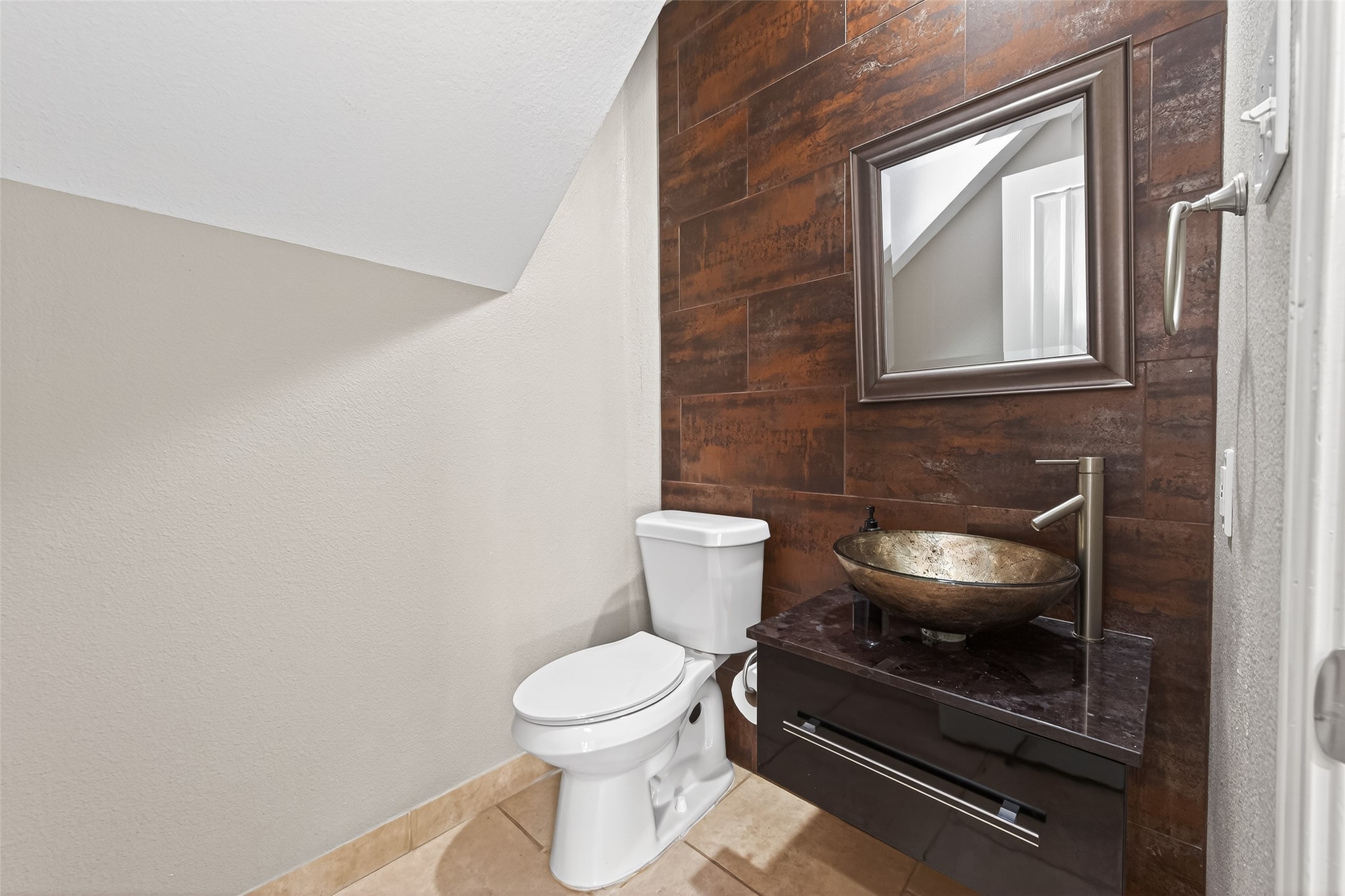 65 Scarlet Woods Court Spring, TX 77380 - Photo 31 of 36 a bathroom with a toilet and a sink