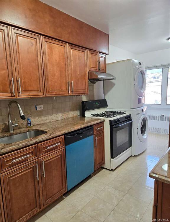 132-20 60th Avenue Queens, NY 11355 - Photo 4 of 8 a kitchen with stainless steel appliances granite countertop a stove a sink and a microwave