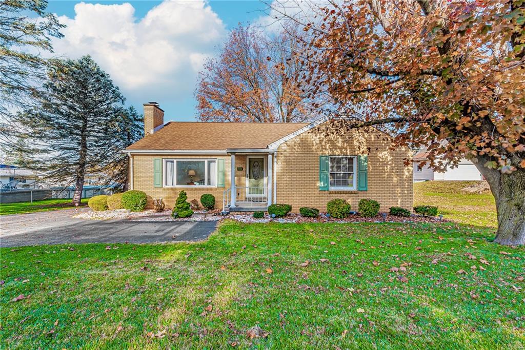 4931 North Rt, Unit 982 Latrobe, PA 15650 - Photo 1 of 22 a front view of house with yard and seating area