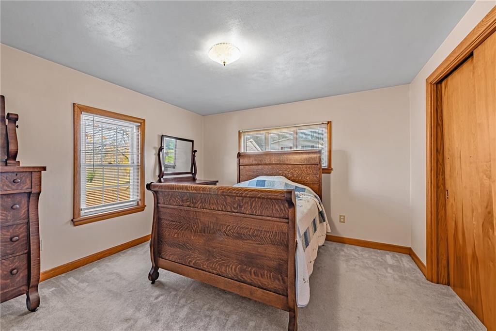 4931 North Rt, Unit 982 Latrobe, PA 15650 - Photo 11 of 22 a bedroom with a bed and a window