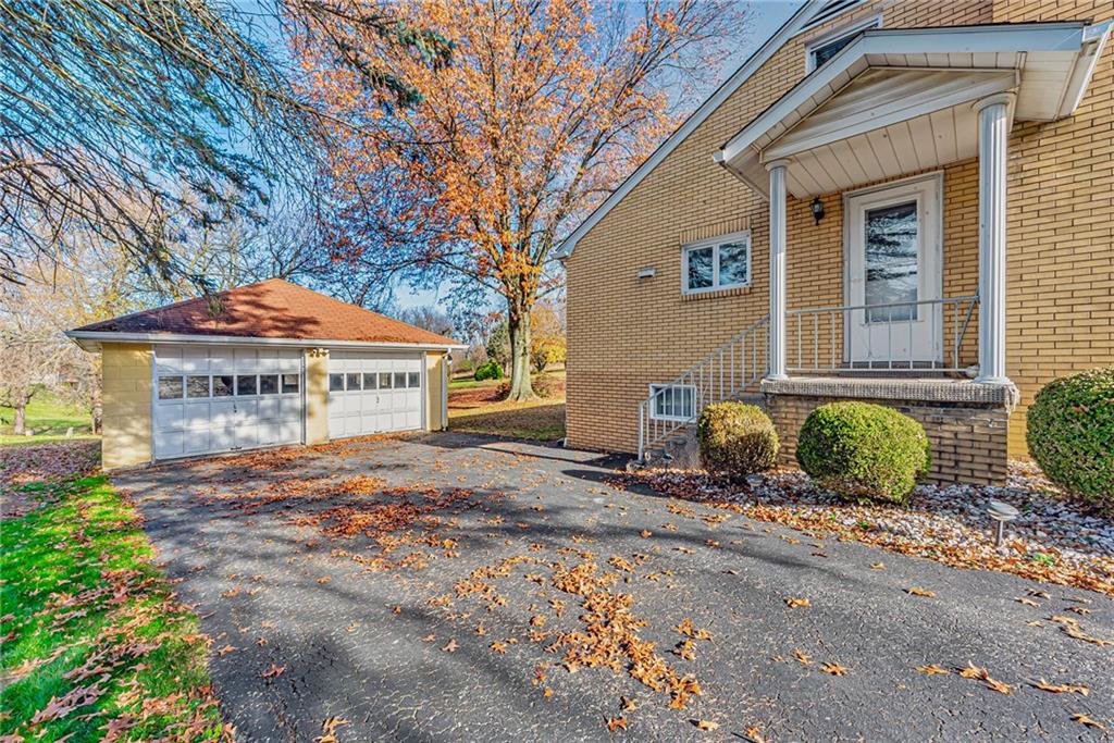4931 North Rt, Unit 982 Latrobe, PA 15650 - Photo 18 of 22 a front view of a house with garden