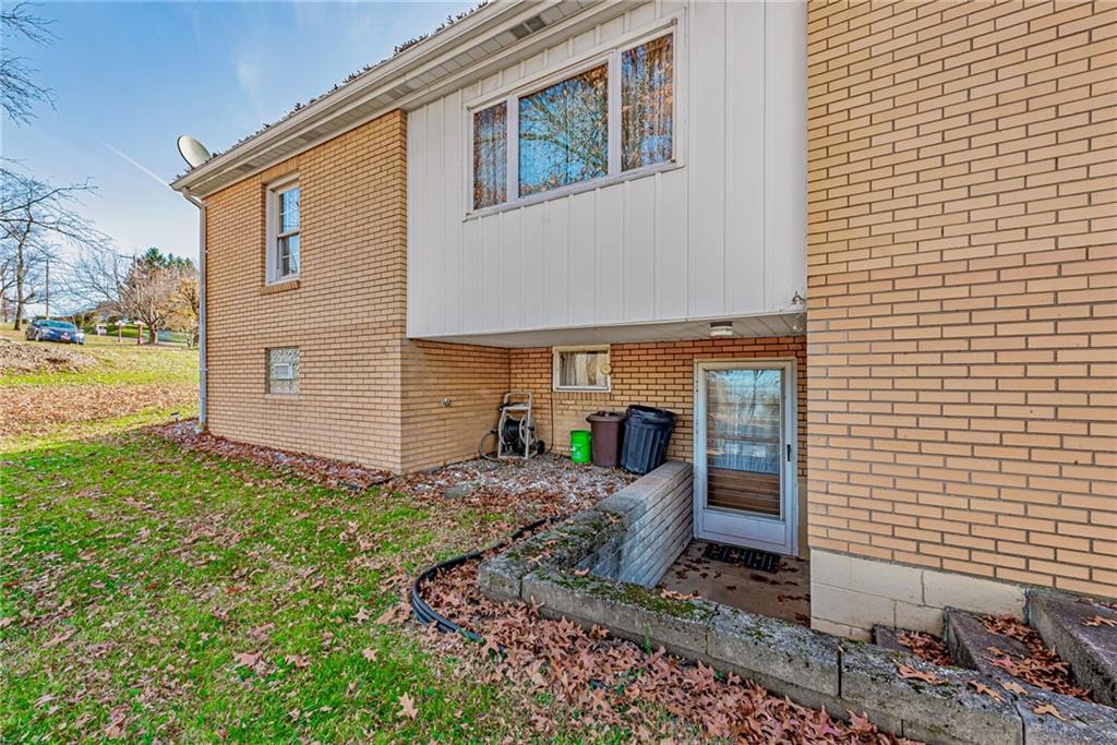 4931 North Rt, Unit 982 Latrobe, PA 15650 - Photo 20 of 22 a front view of a house with garden
