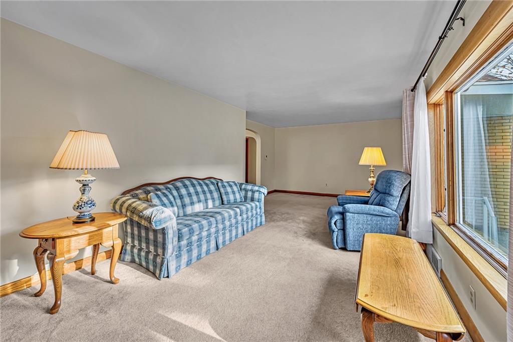 4931 North Rt, Unit 982 Latrobe, PA 15650 - Photo 3 of 22 a bedroom with furniture and a lamp