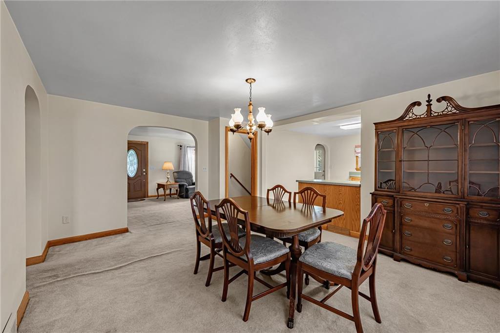 4931 North Rt, Unit 982 Latrobe, PA 15650 - Photo 5 of 22 a dining room with furniture and chandelier