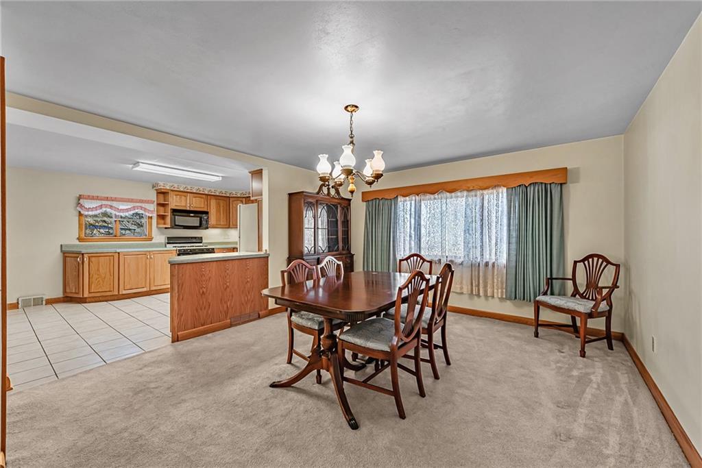 4931 North Rt, Unit 982 Latrobe, PA 15650 - Photo 6 of 22 a view of a dining room with furniture window and outside view