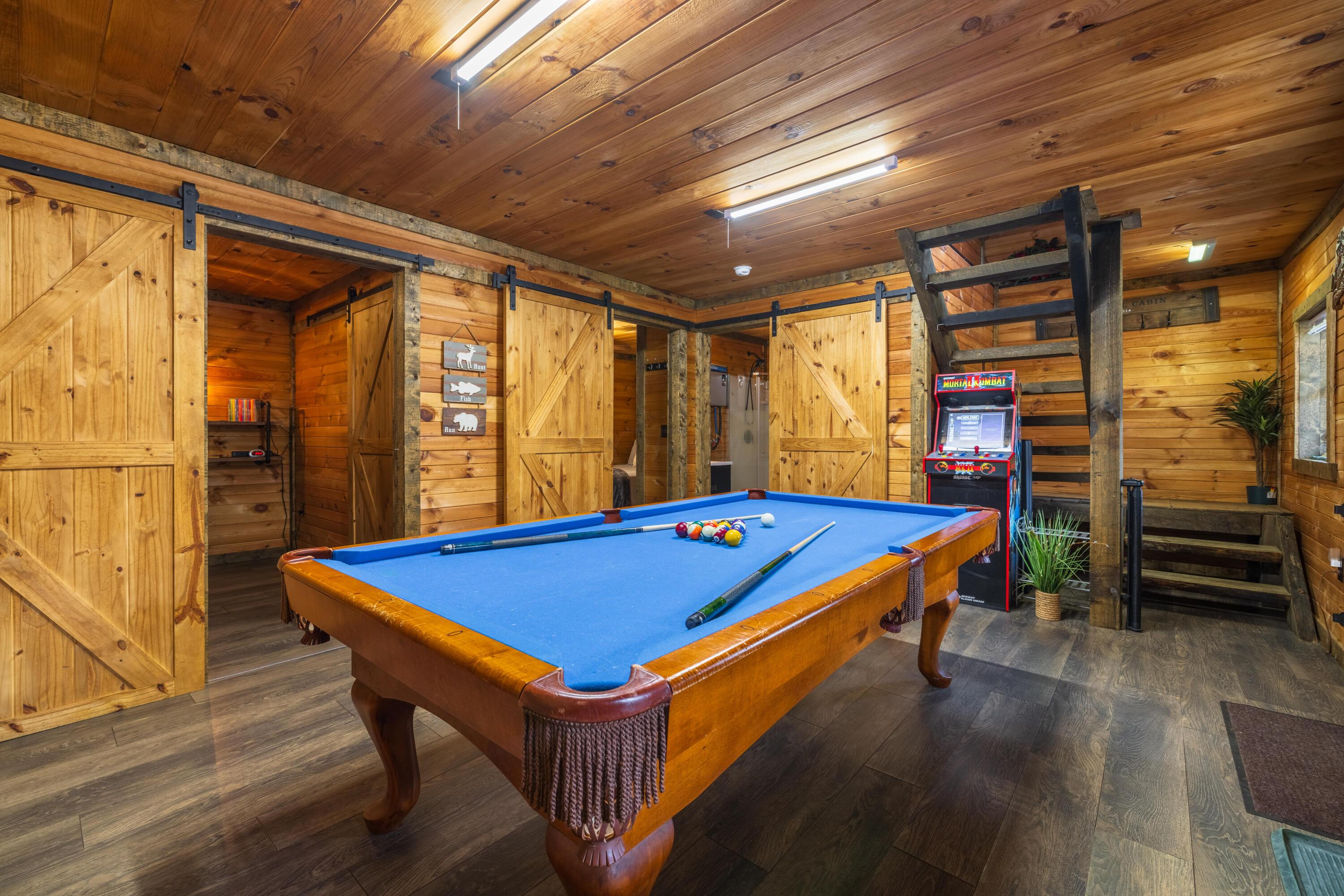 344 Skaggs Road Londonderry, OH 45647 - Photo 42 of 57 Sage Hill Cabin entertainment room with pool table/ping pong table, arcade game, and board games to entertain everyone in the family