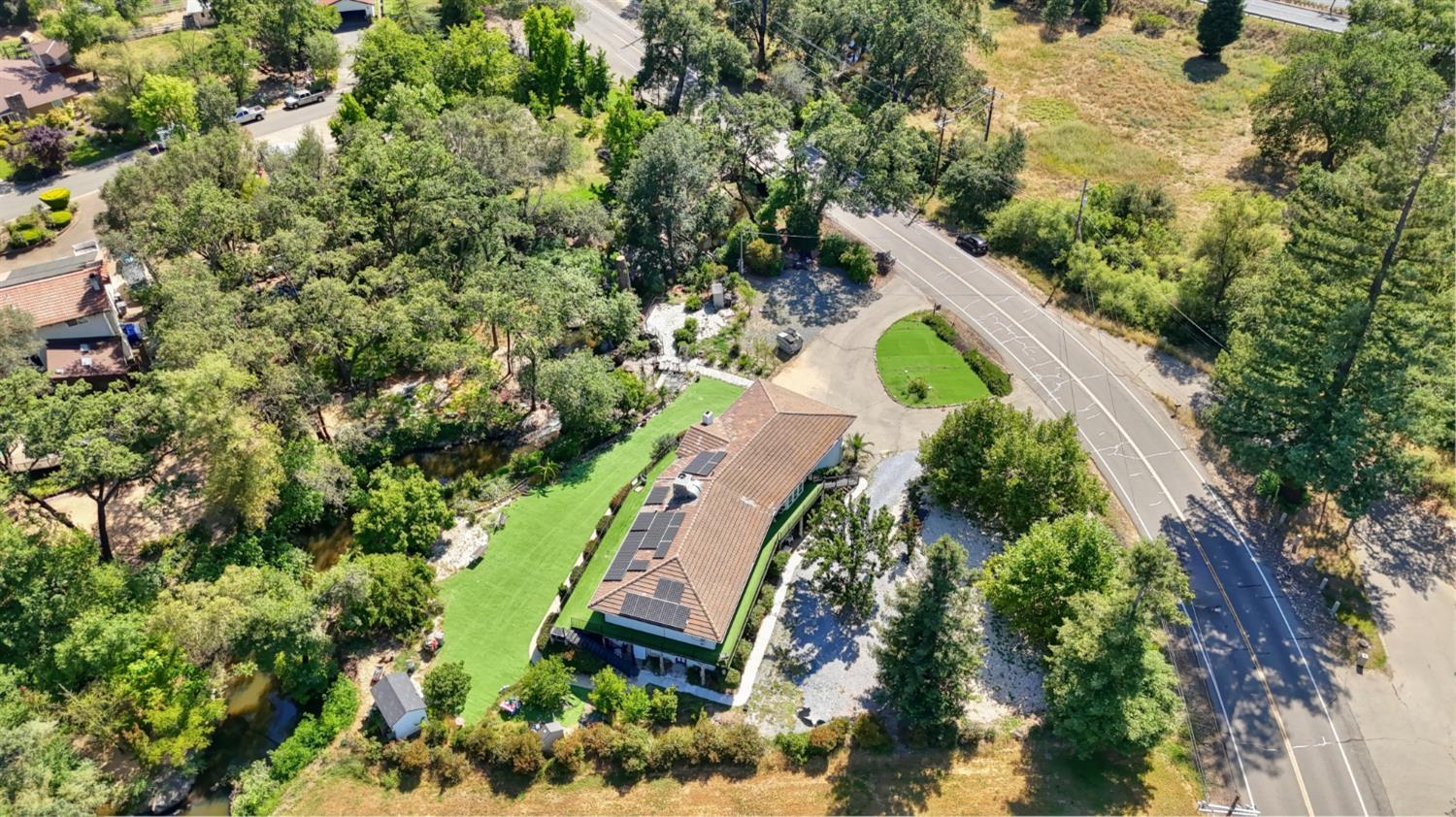 4330 Cavitt Stallman Road Granite Bay, CA 95746 - Photo 79 of 85 an aerial view of a house with a yard and large trees
