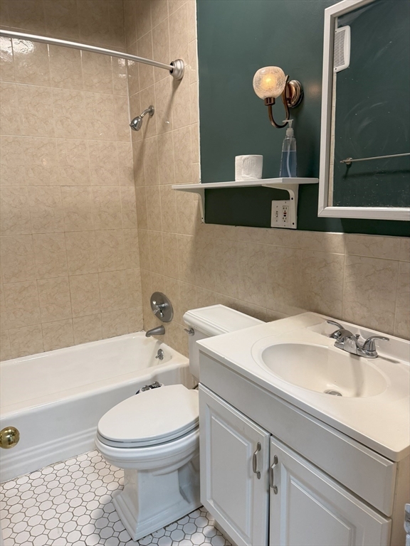 36 Orkney Road, Unit 3 Boston, MA 02135 - Photo 8 of 11 a bathroom with a sink a toilet and shower