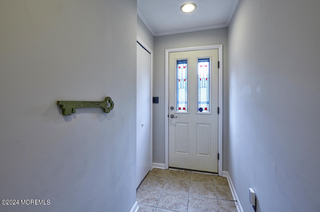 321 Spring Street, Unit 1 Red Bank, NJ 07701 - Photo 2 of 20 an empty room with windows