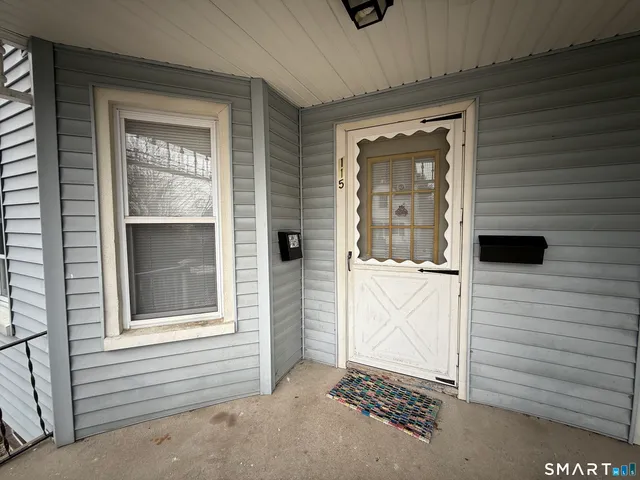 a view of a door and a window