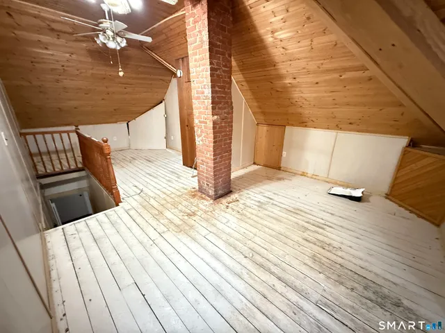 a view of a balcony with wooden floor