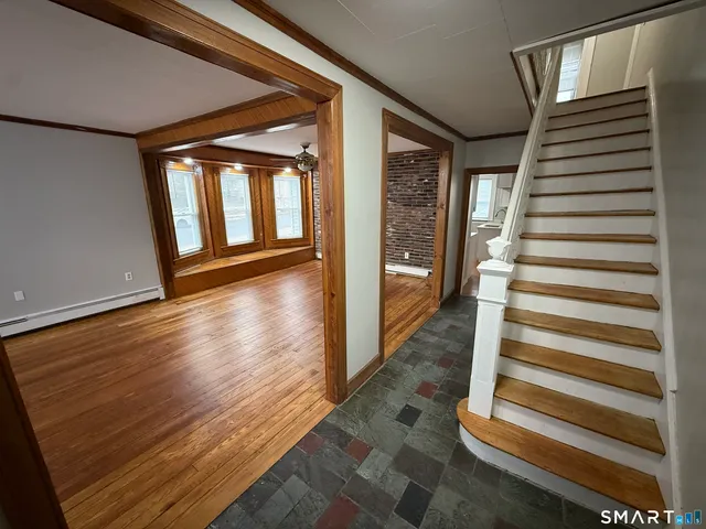 a view of entryway with wooden floor