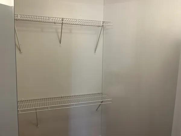 a view of a room with racks on the wall