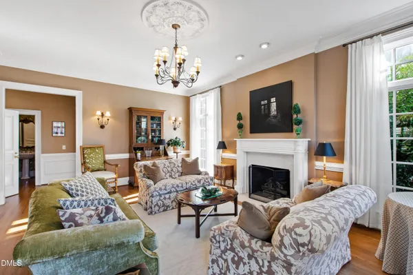 a view of a livingroom with furniture and floor to ceiling window