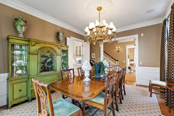 a large kitchen with kitchen island a large counter space a sink appliances and living room view