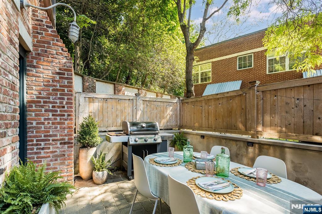 25 Clark Street, Unit 205 Glen Ridge, NJ 07028 - Photo 24 of 28 a backyard of a house with seating space