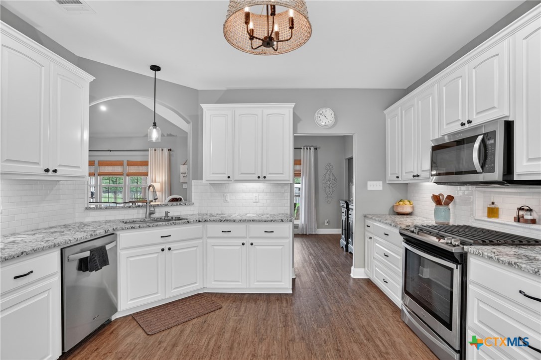 1899 Sunflower Trail Luling, TX 78648 - Photo 13 of 48 Stainless appliances and crisp white cabinets.