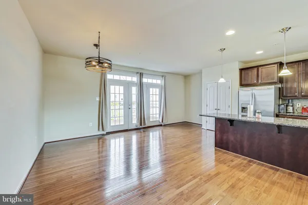 a view of kitchen with window and wooden floor