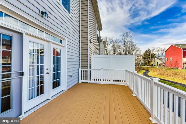 a view of balcony with furniture
