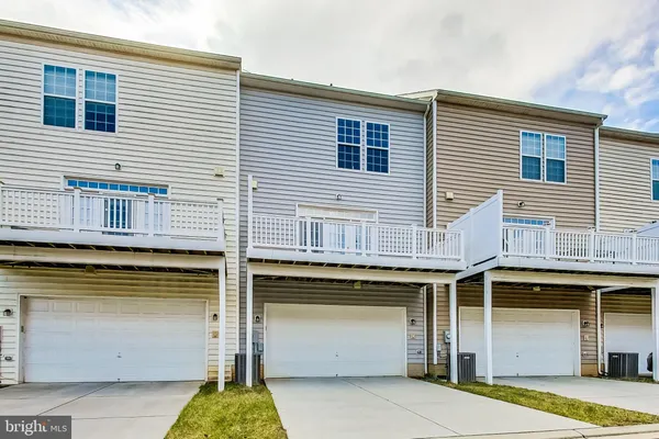 a front view of a house with parking